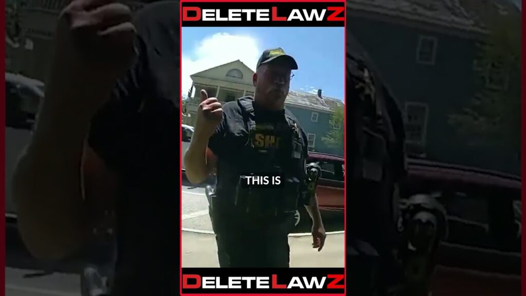 OUT OF CONTROL COP TRIES TO CHARGE AND ARREST INNOCENT LADY