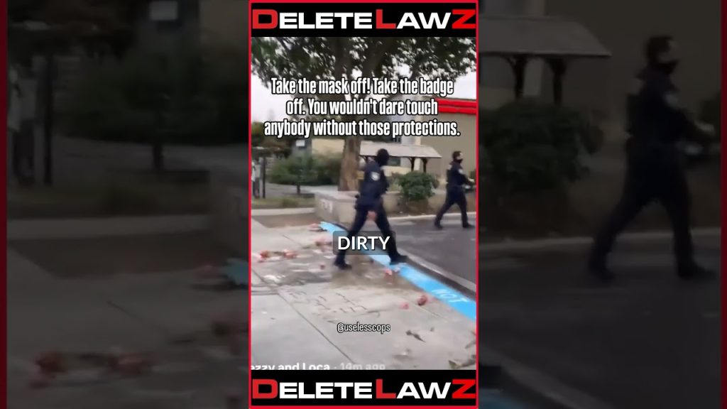 COP WALKS UP AND RANDOMLY PUSHES MAN!