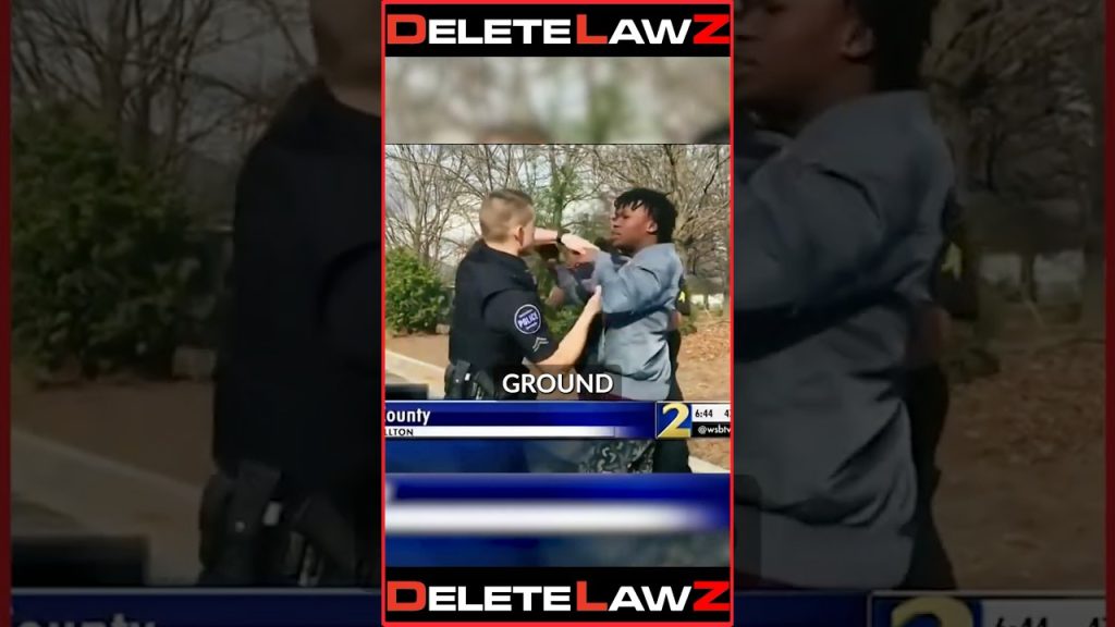 COP P*NCHES HAND-CUFFED GROUNDED MAN IN THE FACE!
