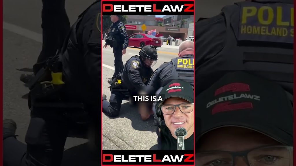 AGGRESSIVE COP POINTS G*N AT BYSTANDERS!