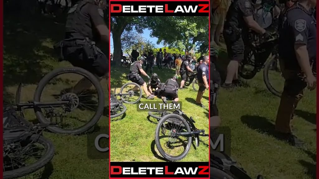 COP STRIKES DEFENSELESS GROUNDED MAN!