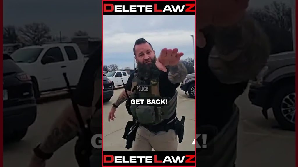 COP KNOCKS PHONE OUT OF WOMAN